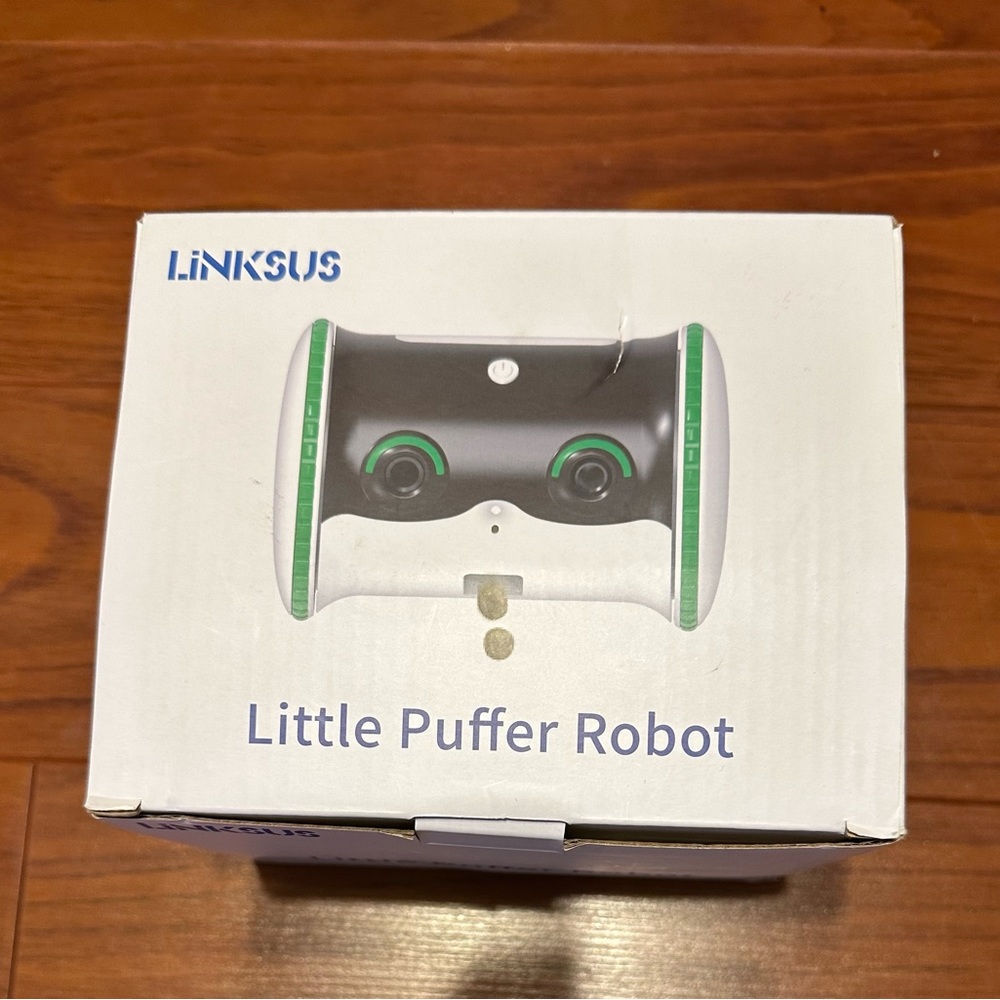 Pet robot treat dispenser with camera.